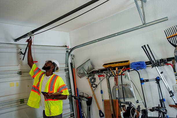 Professional Garage Door Spring Repair technician working in Greensboro, AL